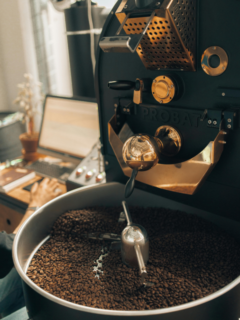 Coffee beans roasting to perfection, capturing the rich aroma and deep flavor of SplitShot coffee.